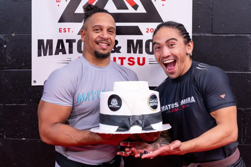 Kelvyn Matos and Manny Mora celebrating with a Matos & Mora cake