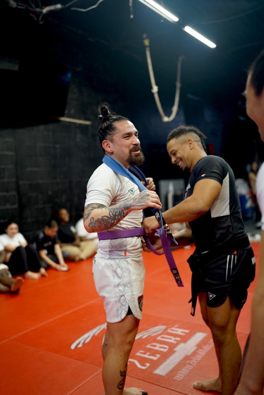 A belt moment on the mats at Matos & Mora